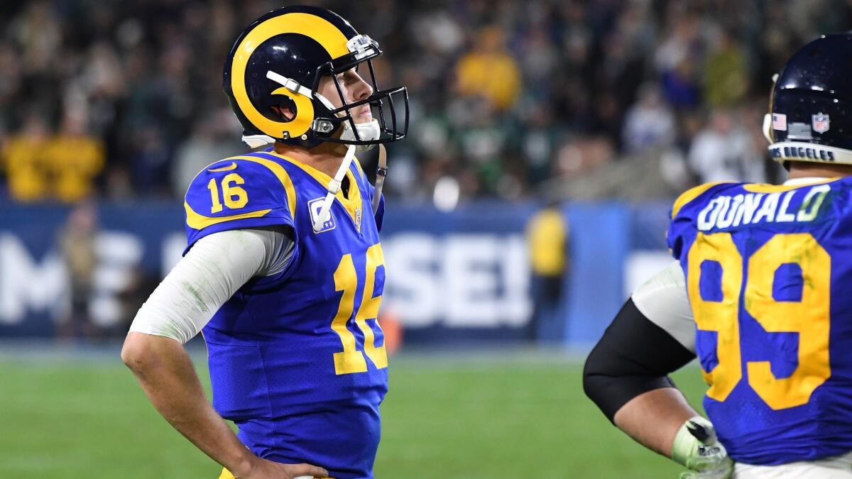 Rams quarterback Jared Goff watches as his team fails to convert on fourth down on a fake punt against the Eagles in the third quarter at the Coliseum.