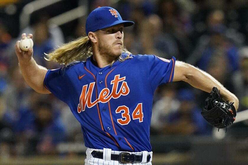 New York Mets' Noah Syndergaard pitches during the first inning in the second baseball game.