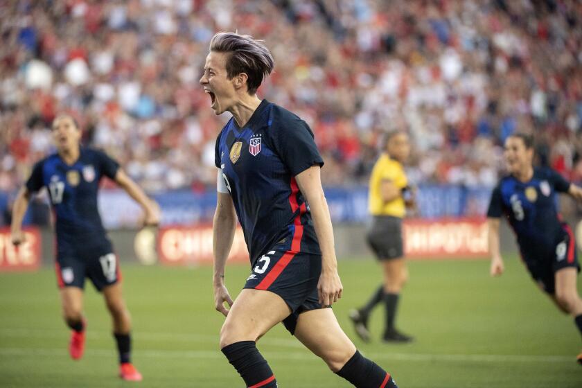 United States forward Megan Rapinoe (15) celebrates after scoring on a free kick against Japan during the first half of a SheBelieves Cup women's soccer match, Wednesday, March 11, 2020 at Toyota Stadium in Frisco, Texas. (AP Photo/Jeffrey McWhorter)