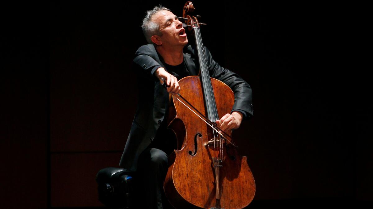 Italian cellist Giovanni Sollima improvises Sunday afternoon at Bovard Auditorium during the opening gala of the Piatigorsky International Cello Festival.