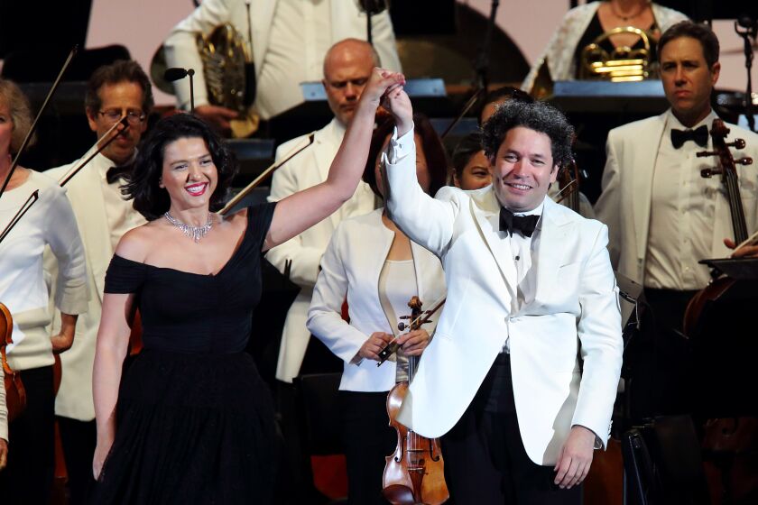 Hollywood Bowl Bravo Gustavo! 10 Years with the Los Angeles Philharmonic. The evening soloist was Khatia Buniatishvili, left, who was meant to play a Bowl ritual, RachmaninoffÕs Third Piano Concerto. But a shoulder injury forced her to make a last-minute change to TchaikovskyÕs First Piano Concerto, which then opened the program. Her virtuosity remained on prominent display, but the extra practice to work up the Rachmaninoff might have caused further muscle strain.