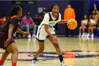 Izela Arenas of Sierra Canyon dribbles against Corona Centennial on Saturday night in an Open Division playoff game.