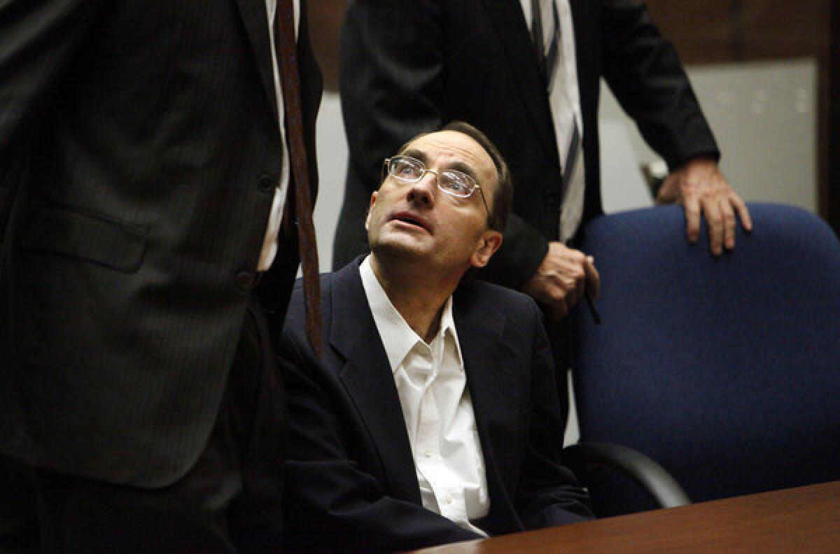 Christian Karl Gerhartsreiter talks with his attorneys before the guilty verdict is read.