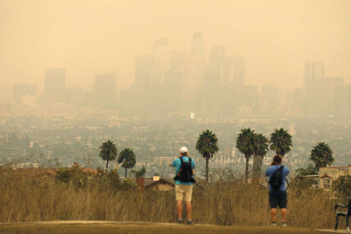 The Los Angeles skyline is shrouded in smoke