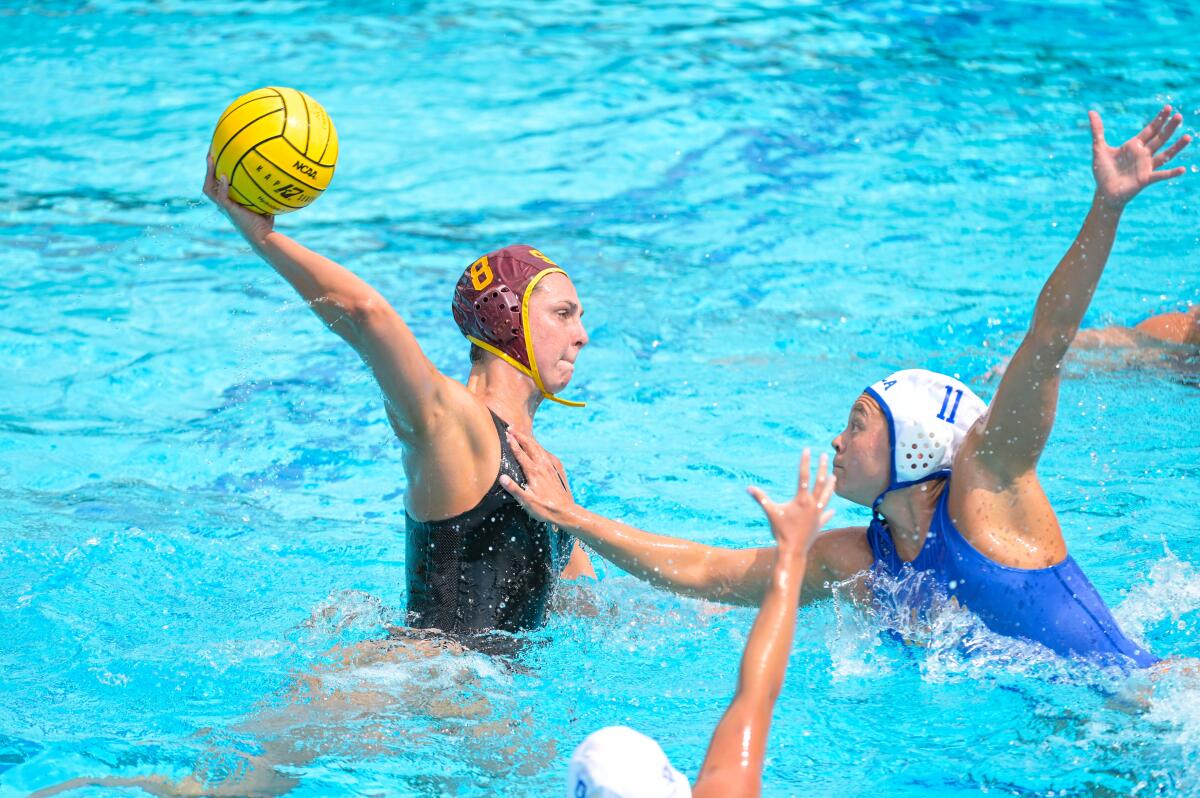 USC's Denise Mammolito looks to shoot past UCLA's Val Ayala during the 2021 NCAA women's water polo final on Sunday.