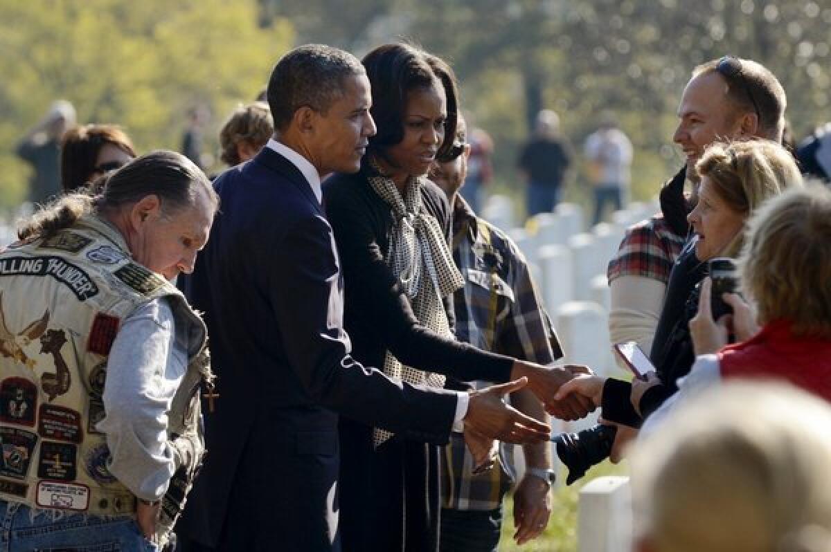 President Obama and First Lady Michelle Obama visit Arlington National Cemetery on Sunday, Veterans Day.