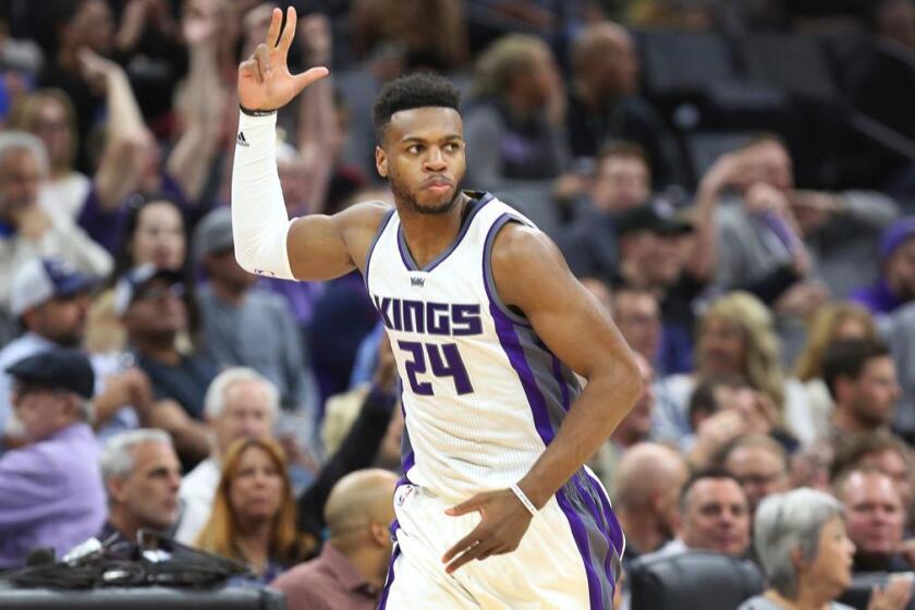 Sacramento Kings guard Buddy Hield (24) signals after hitting a three-point shot against the Memphis Grizzlies in the first half of an NBA basketball game in Sacramento, Calif., Monday, March. 27, 2017. (AP Photo/Steve Yeater)