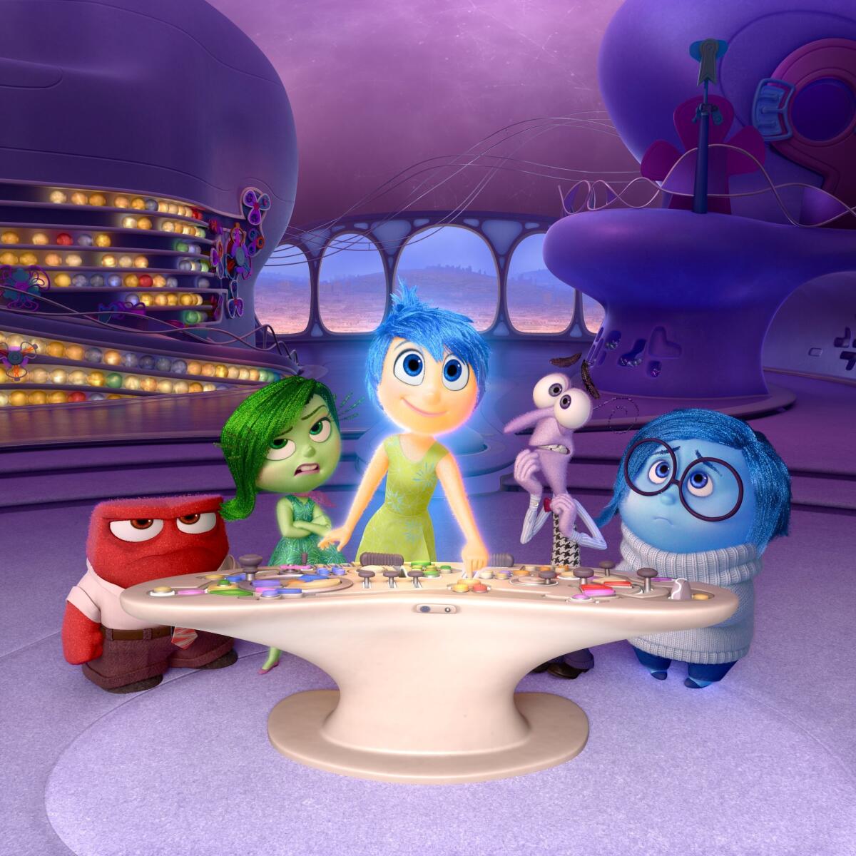 Disney-Pixar characters, from left, Anger, voiced by Lewis Black; Disgust, voiced by Mindy Kaling; Joy, voiced by Amy Poehler; Fear, voiced by Bill Hader; and Sadness, voiced by Phyllis Smith appear in a scene from "Inside Out."