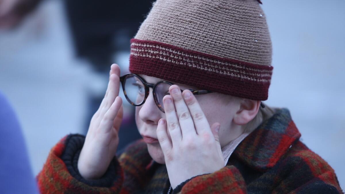 Andy Walken, who plays Ralphie Parker, adjusts his glasses during rehearsals of "A Christmas Story."