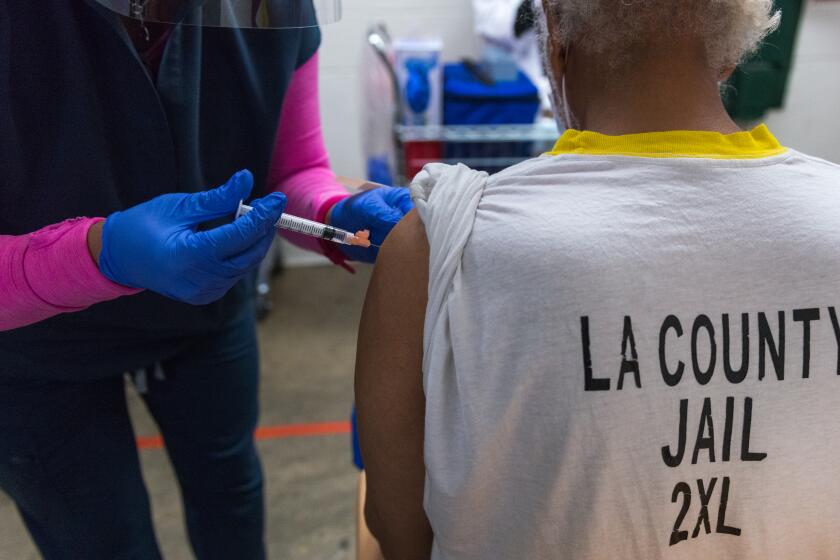 An inmate at the L.A. County jail receives the Johnson & Johnson covid vaccine.