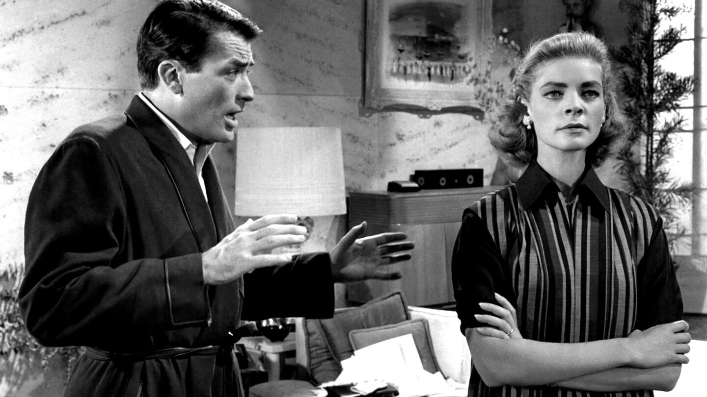 Gregory Peck tries to explain himself to an upset Lauren Bacall in a scene from the 1957 film "Designing Woman." The film's production occurred while Bacall's husband's health was deteriorating.