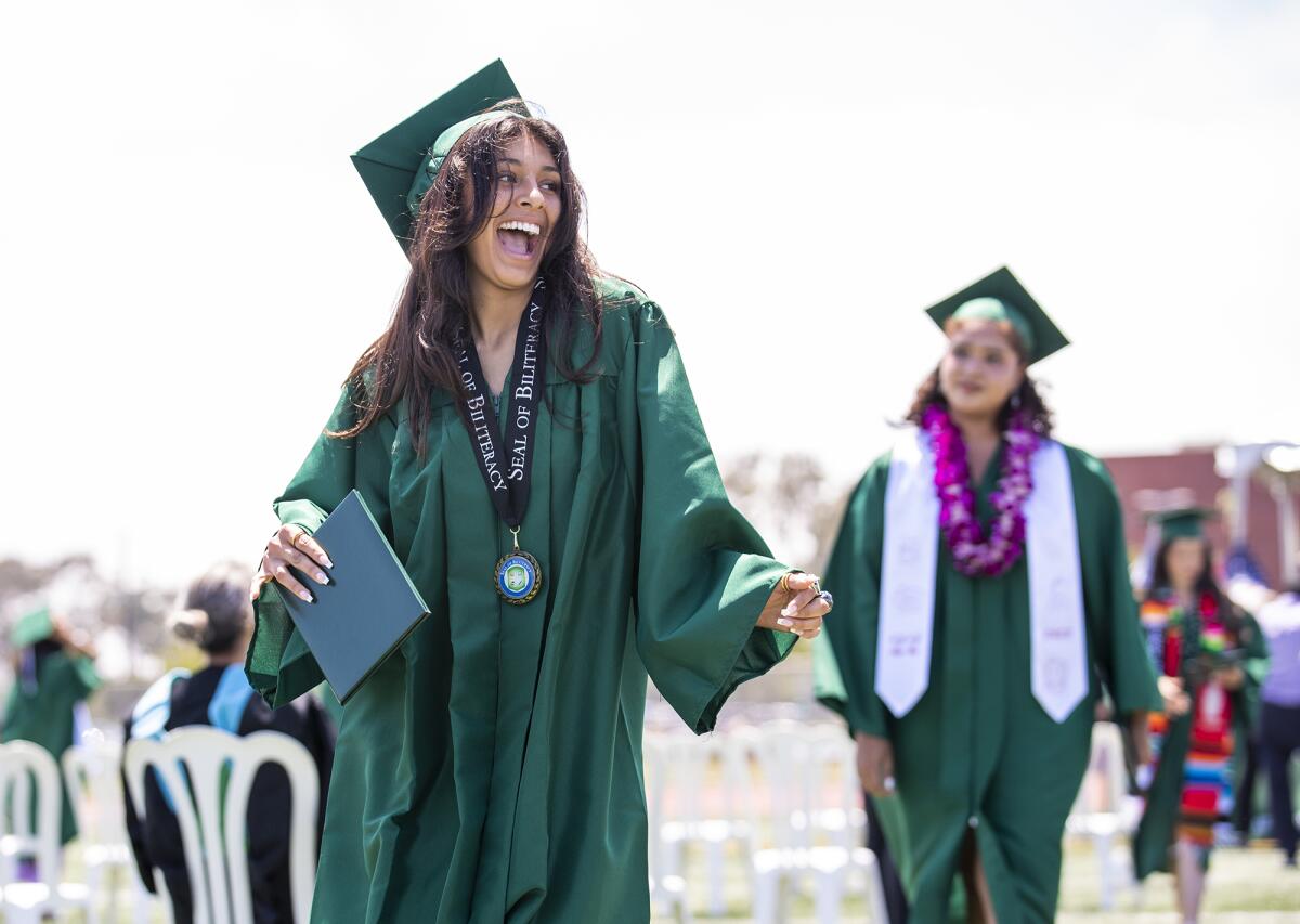 Costa Mesa High graduate Julissa Garibay celebrates Thursday after receiving her diploma.