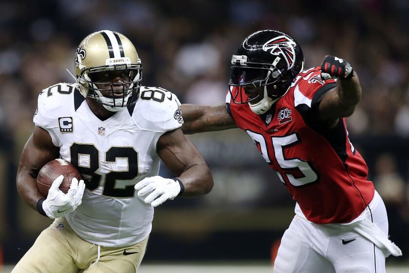 Saints tight end Benjamin Watson picks up yards after a reception against Falcons safety William Moore in the third quarter Thursday night.
