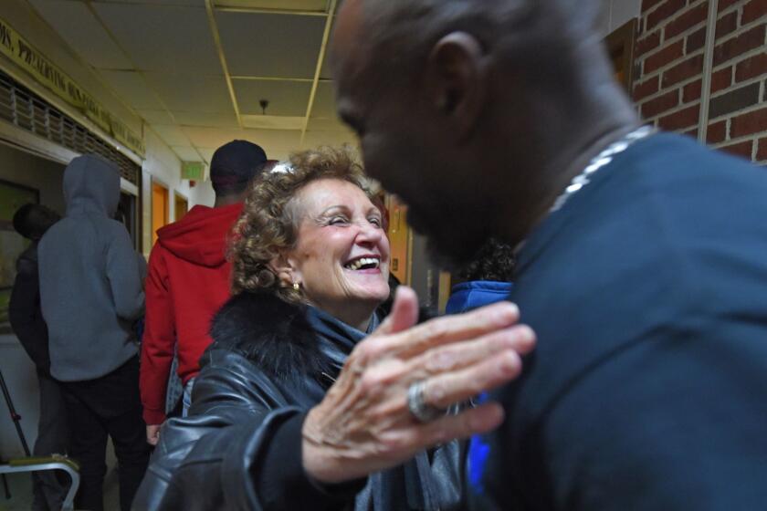 Rikki Spector hugs Melvin Willingham who runs of Makings of a Man mentorship program at the Samuel FB Morse Recreation Center. Former City Councilwoman Rikki Spector has been meeting and mentoring the two juveniles who carjacked her last year, through the non-profit U Empower of MD, The non-profit teaches youths to become chefs and turn their lives around. Spector says she's making it her mission to help juvenile offenders after she became the victim of crime. (Lloyd Fox/Baltimore Sun Media Group/TNS) ** OUTS - ELSENT, FPG, TCN - OUTS **