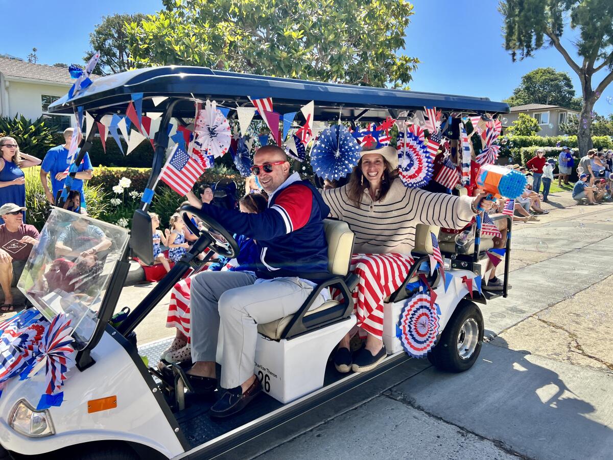 A bubble gun accessorizes a patriotic cart heading down Beaumont Avenue in Bird Rock during the area's Fourth of July parade.