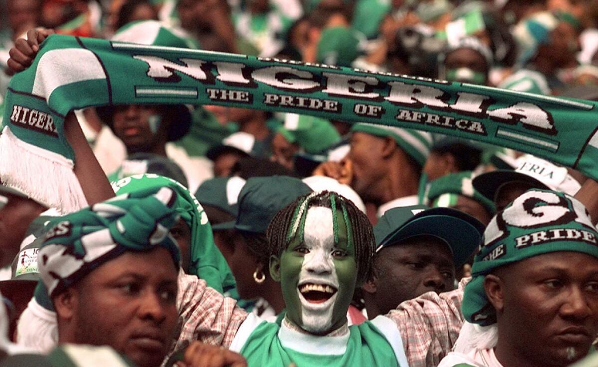 Nigerian soccer fans wait for the start of the soccer World Cup 98 second round match between Nigeria and Denmark at the Stade de France in Saint Denis, north of Paris Sunday, June 28, 1998. The winner of the game will play against Brazil in the quarterfinals in Nantes on July 3.