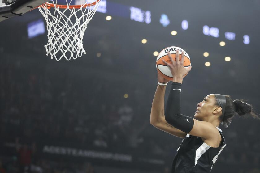 Las Vegas Aces center A'ja Wilson goes up for a basket during the first half of a WNBA Semifinal basketball game, Sunday, Oct. 6, 2024, in Las Vegas. (AP Photo/Ian Maule)