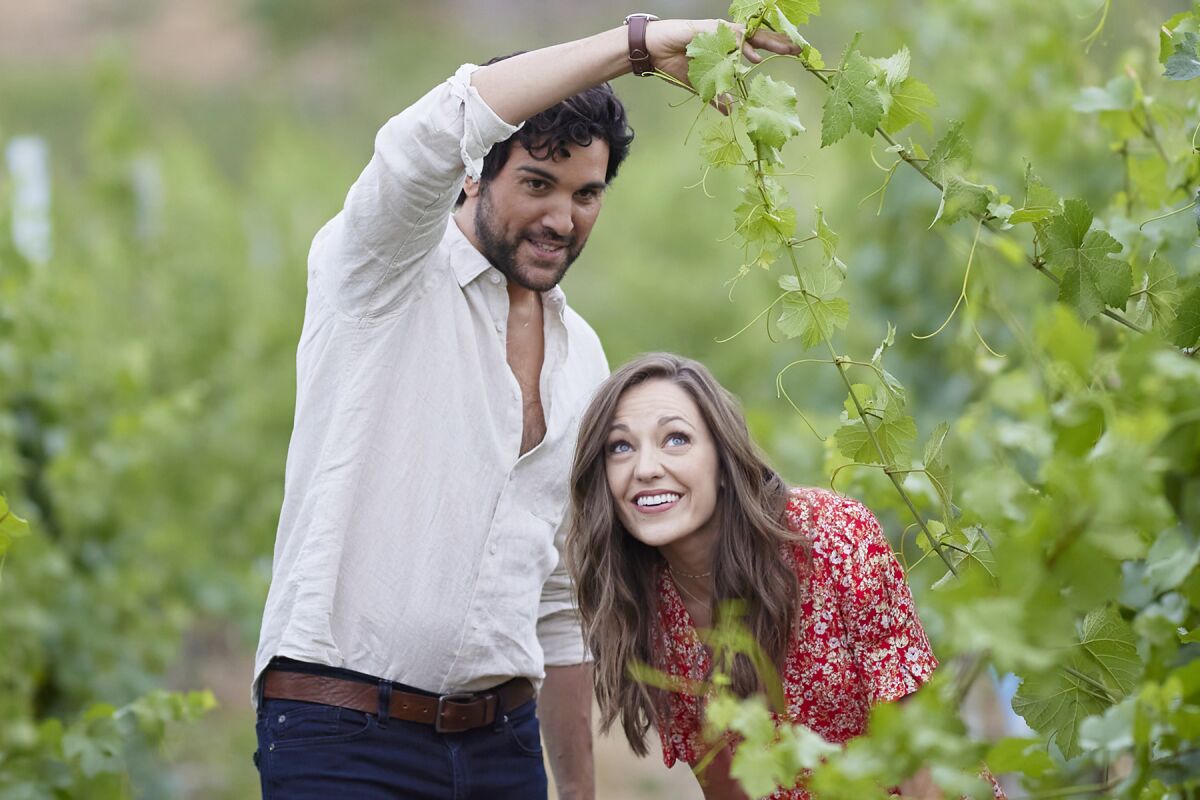  Juan Pablo Di Pace, left, and Laura Osnes in "Raise a Glass to Love" on Hallmark.