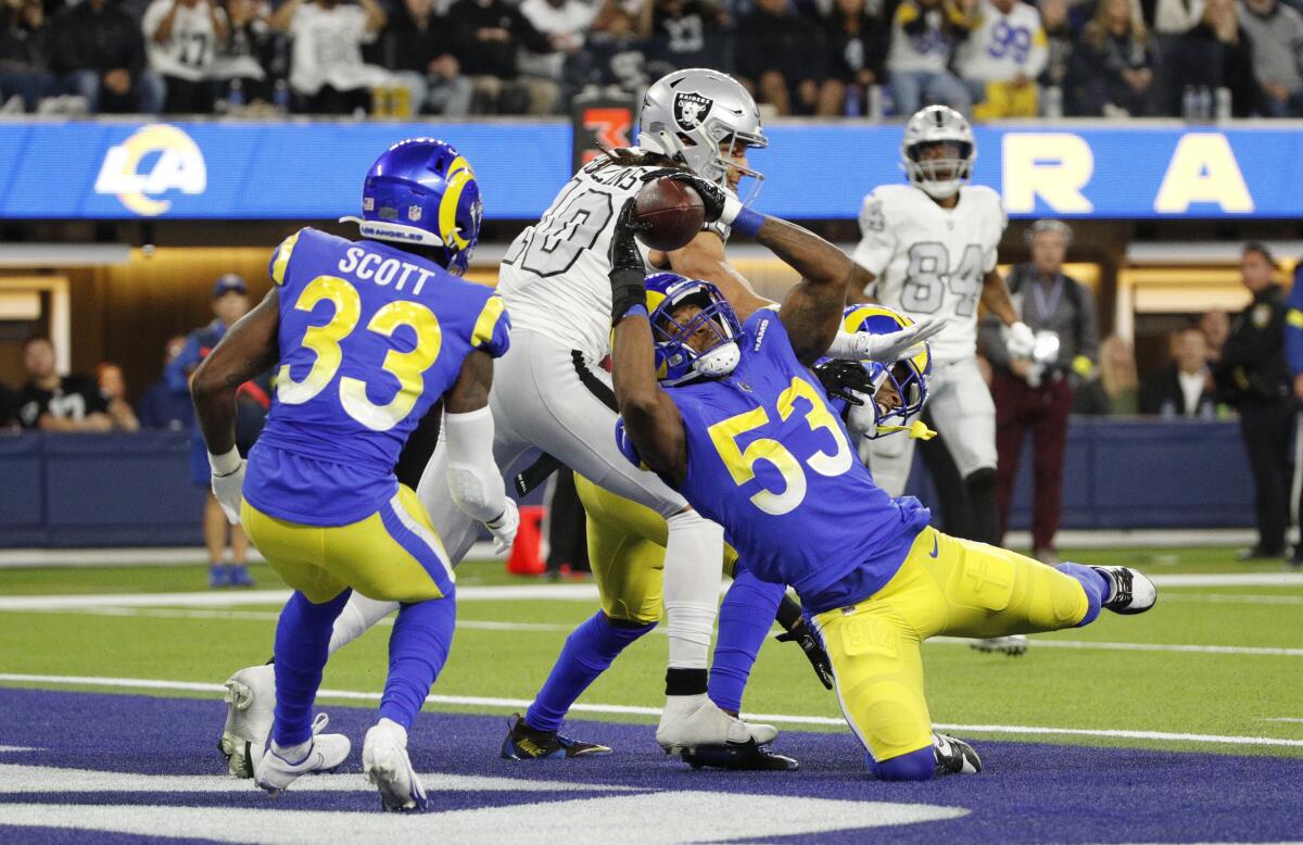 Rams linebacker Ernest Jones (53) intercepts a pass by Raiders quarterback Derek Carr at SoFi Stadium