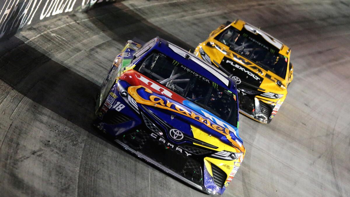 NASCAR driver Kyle Busch leads Matt Kenseth through a turn during the Monster Energy NASCAR Cup Series Bass Pro Shops NRA Night Race at Bristol Motor Speedway on Saturday.