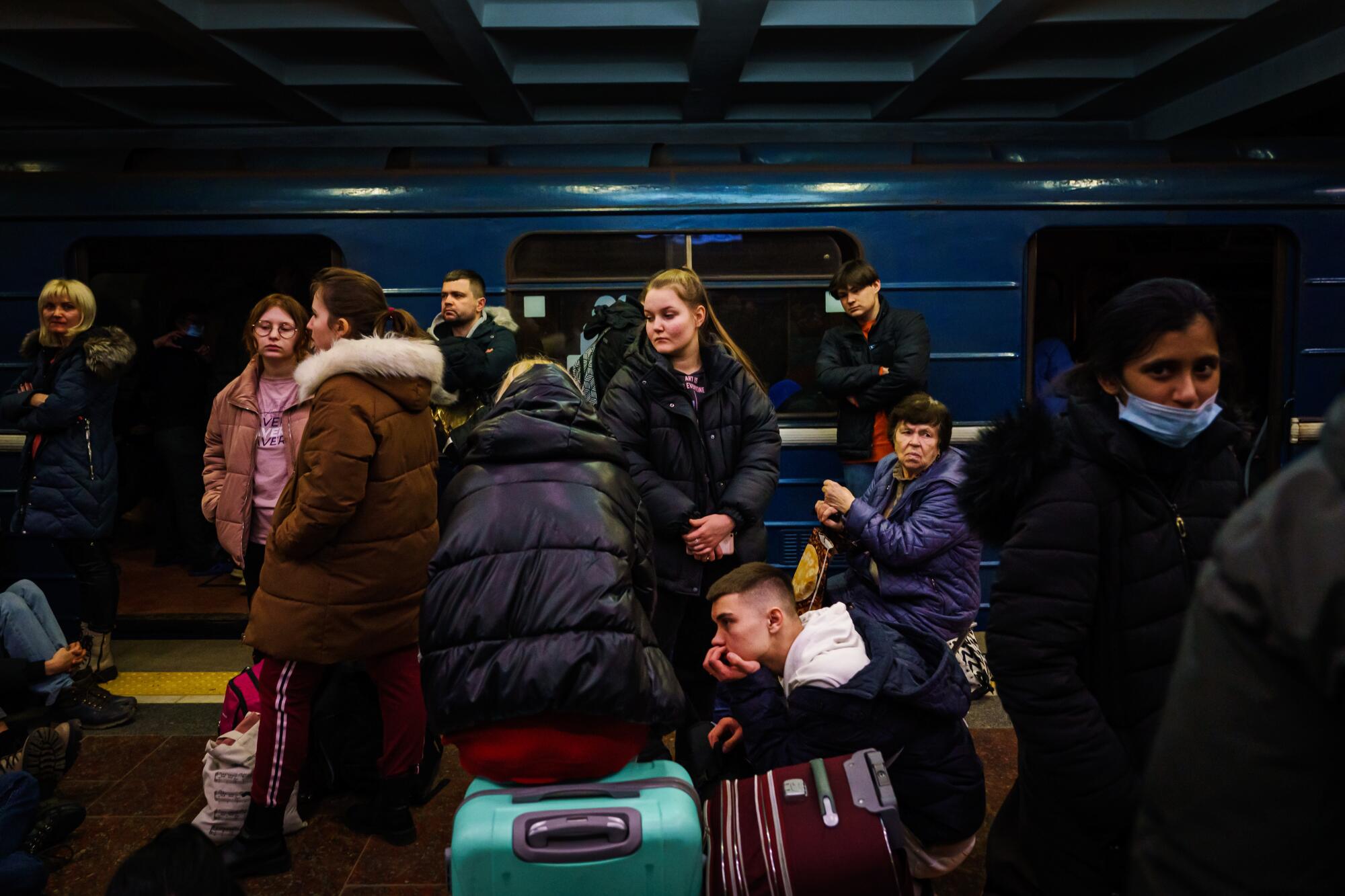 Hundreds of people seek shelter in a subway station.