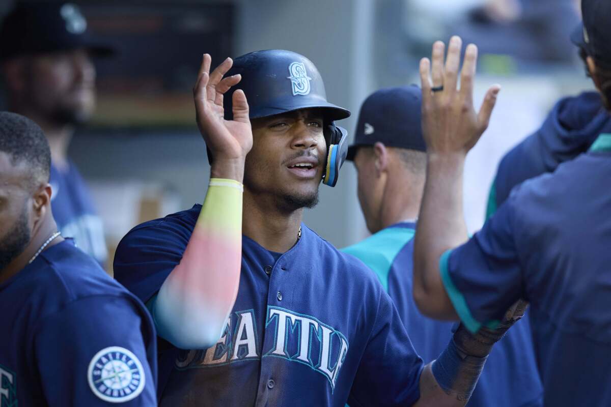 Julio Rodriguez feeling 'a little bit better,' but foot issue keeps him out  of Mariners lineup again