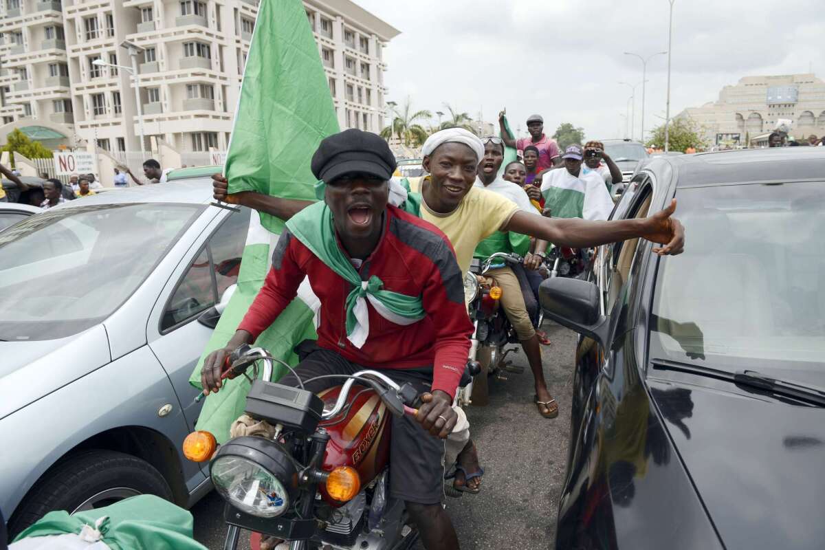 Supporters celebrate after the May 2015 inauguration of Nigerian President Muhammadu Buhari in Abuja, the capital.