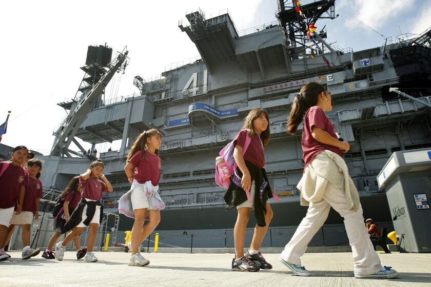 Second-graders from King-Chavez Primary Academy tour the USS Midway Museum as part of the the Heroes Tour, where they learn about different jobs on the ship and the character traits associated with doing a good job The Midway has fast become one of San Diego's field trip hot spots. In five years it has reached capacity in its four classrooms and has a waiting list if you don't book within the first three weeks of reservations opening for the year. Here, students get ready to board the ship on Wednesday, May 20, 2009. (The soup is fake) Photo by K.C. Alfred / The San Diego Union-Tribune