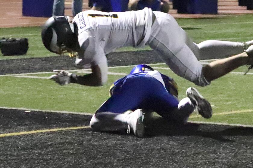 Marina's Gabe Carles (1) dives into the end zone for a touchdown during Marina High School's football team against Fountain Valley High School's football team in a non league game at Westminster High School in Westminster on Friday, September 6, 2024. (Photo by James Carbone)