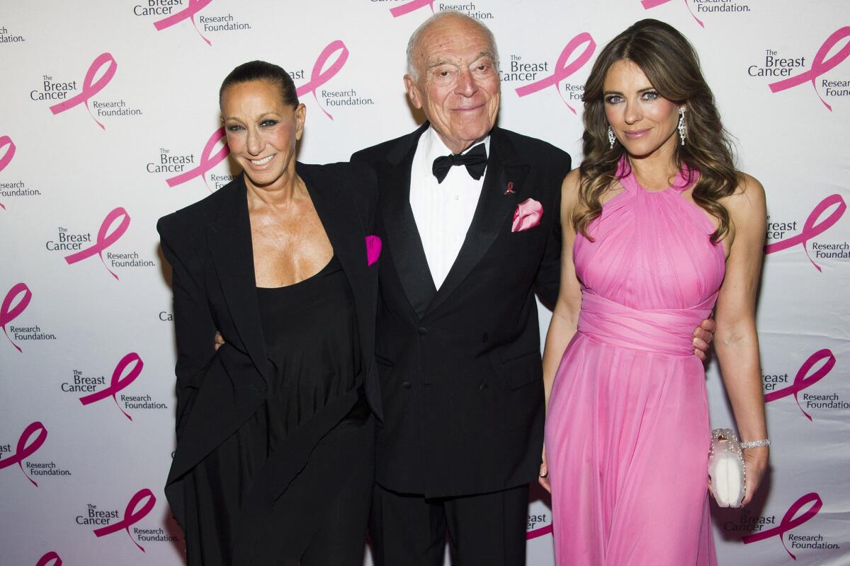 Donna Karan, left, and Leonard A. Lauder keep pink to a minimum while co-host Elizabeth Hurley goes all out at the Breast Cancer Research Foundation Hot Pink Party on Monday.