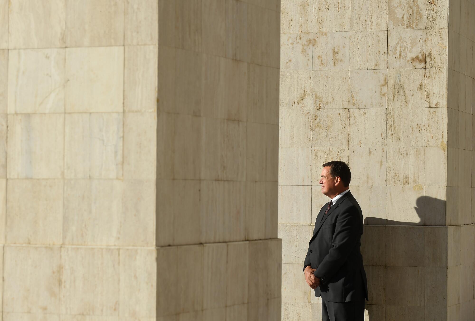 USC athletic director Mike Bohn stands inside the Coliseum. 