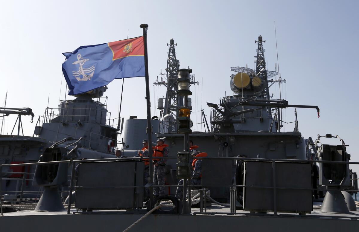 Montenegrin sailors are shown aboard the warship Koto" in the harbor of Bar, Montenegro, on March 15.