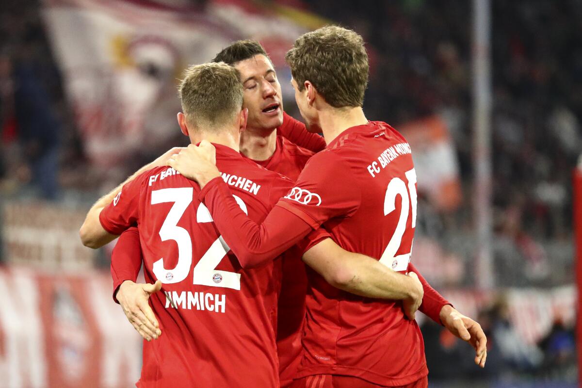 Bayern's Robert Lewandowski celebrates after scoring his side's fourth goal during the German soccer cup match between Bayern Munich and TSG Hoffenheim in Munich, Germany, on Wednesday.