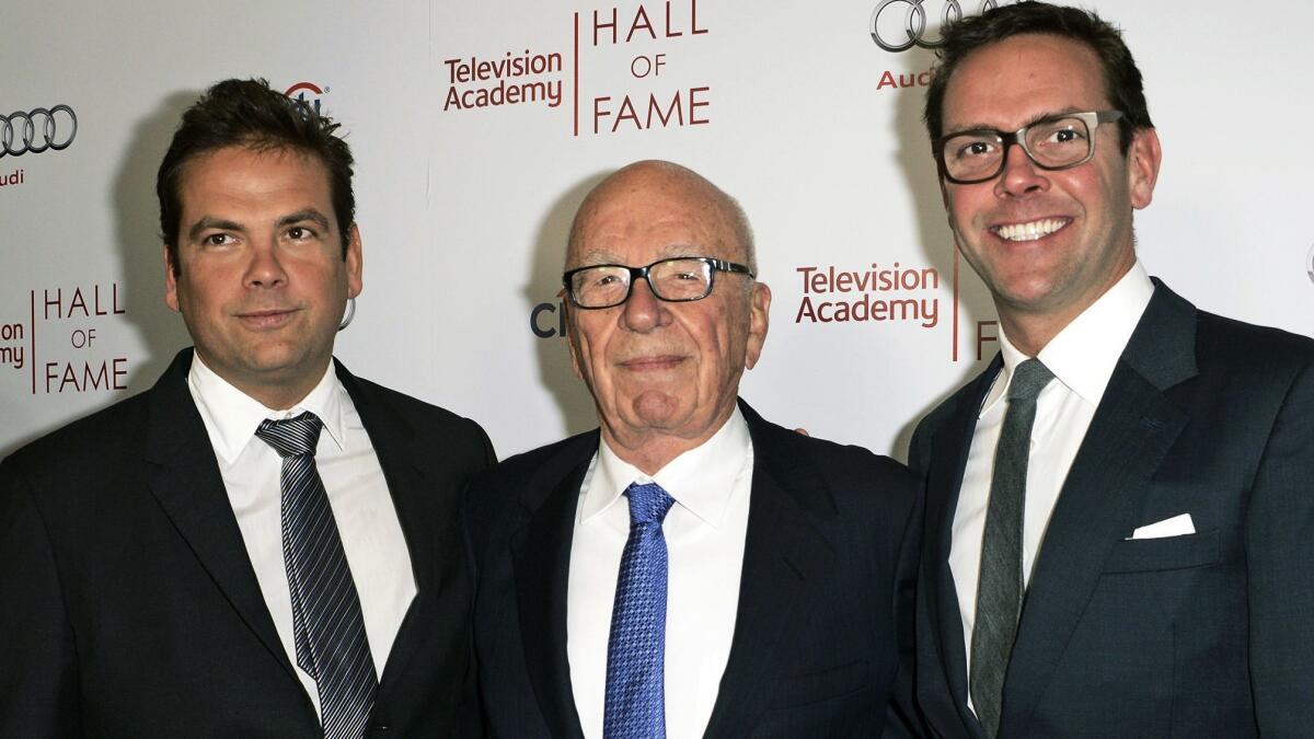 Rupert Murdoch, center, and sons Lachlan, left, and James Murdoch attend a 2014 Television Academy event in Beverly Hills.