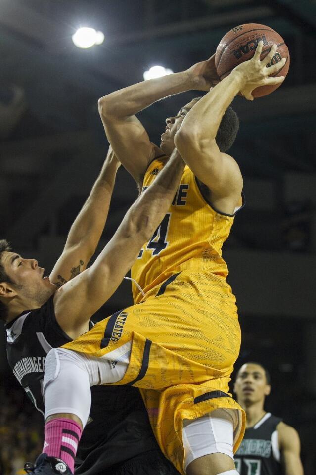 UC Irvine's Dominique Dunning goes up for a shot against Hawaii's Christian Standhardinger during a game on Saturday.