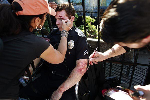 Shawn Hatosy has makeup applied for a car crash scene on Turner Network Television's "Southland," filming in the Elysian Park neighborhood of Los Angeles on Feb. 10. Hatosy plays Officer Sammy Bryant in the TV drama, which follows the lives of Los Angeles Police Department officers and detectives.