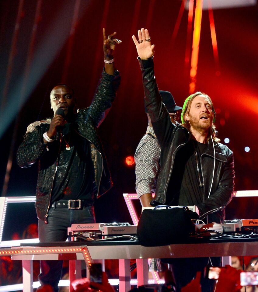 Akon, left, Ne-Yo and DJ David Guetta perform onstage during the 2013 Billboard Music Awards.