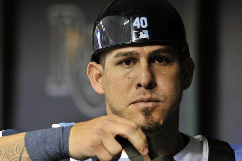 FILE - In this July 9, 2018, file photo, Tampa Bay Rays catcher Wilson Ramos heads for the field during a baseball game against the Detroit Tigers, in St. Petersburg, Fla. The NL East-leading Philadelphia Phillies have acquired All-Star catcher Wilson Ramos from the Tampa Bay Rays for a player to be named or cash, Tuesday, July 31, 2018.(AP Photo/Steve Nesius, File)