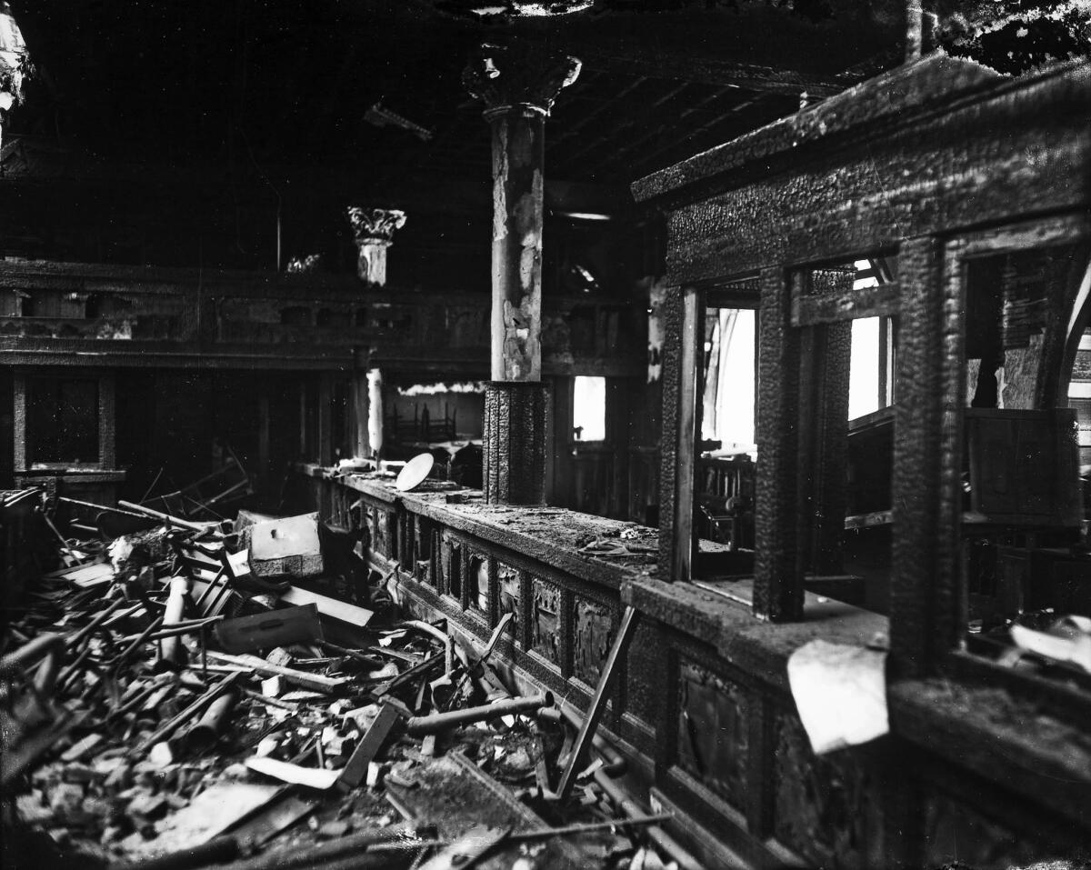 Oct. 1910: The burned remains of the main business counter, which used wood from dozens of sources, including California missions and a piece of the bed in which Abraham Lincon died.