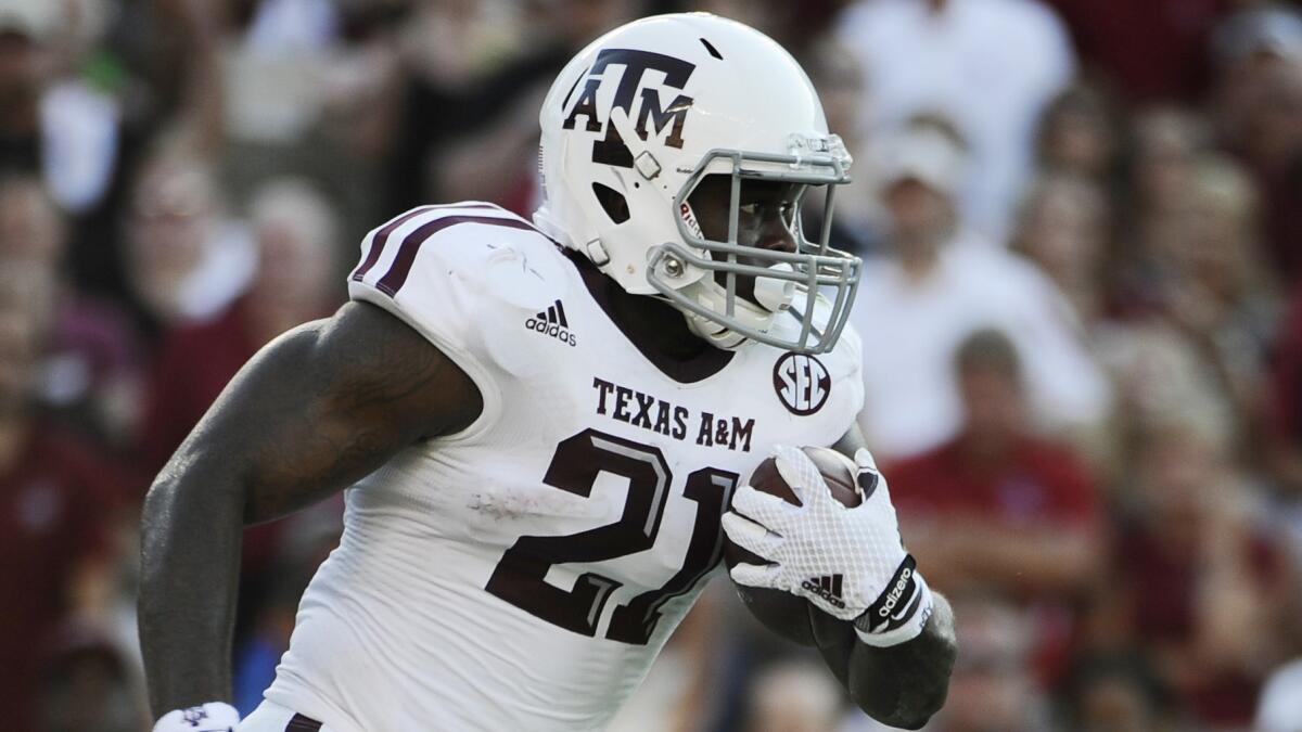 Texas A&M running back Tra Carson carries the ball during the team's 52-28 victory over South Carolina on Thursday.