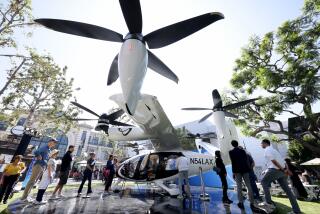 LOS ANGELES, CA - - SEPTEMBER 26, 2024 - People observe check out the flying taxi created by Joby Aviation at The Grove in the Fairfax District in Los Angles on September 25, 2024. Joby Aviation, Inc., is one of a handful of companies racing to be the first to make flying taxis a reality in Los Angeles. The California-based transportation company has developed the all-electric, vertical take-off and landing air taxi which it intends to operate as part of a fast, quiet, and convenient service in cities around the world. (Genaro Molina / Los Angeles Times)