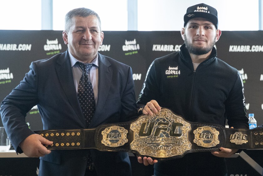 UFC lightweight champion Khabib Nurmagomedov, right, and his father Abdulmanap Nurmagomedov.