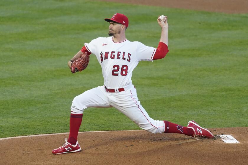 Los Angeles Angels starting pitcher Andrew Heaney (28) throws during the first inning.