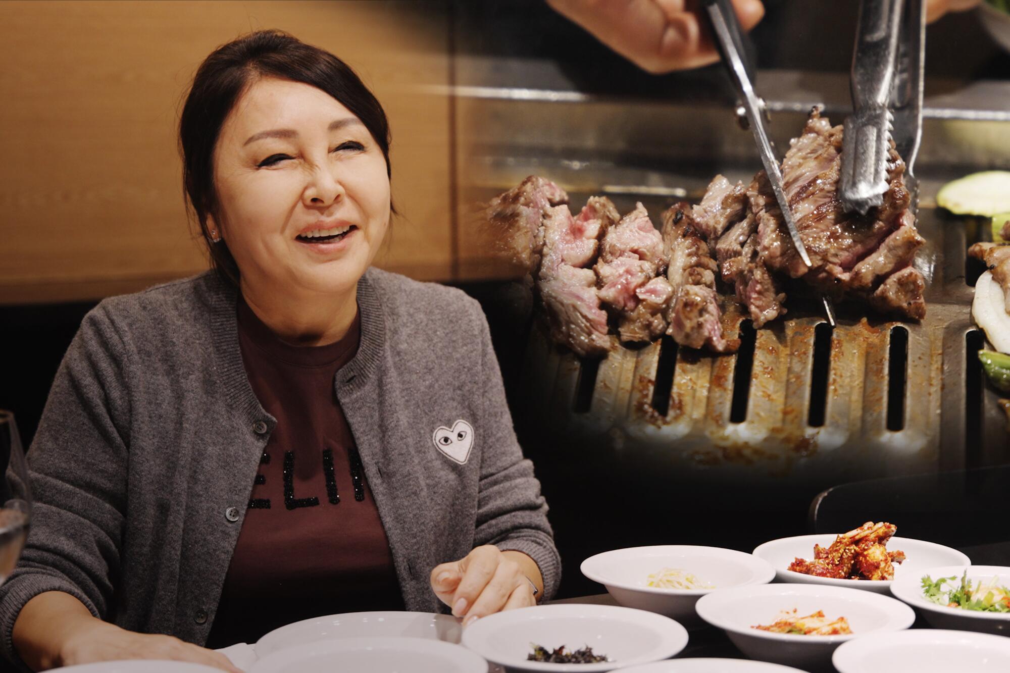 Jenee Kim of Park's BBQ sits at a table with several white plates of food before her