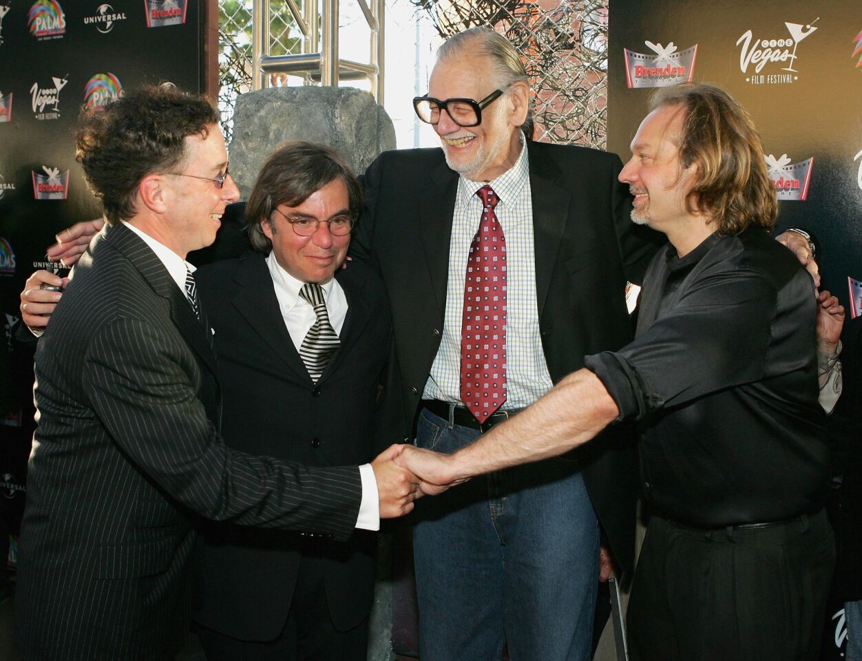 Producers Mark Canton and Peter Grunwald, left, with director George Romero and special makeup effects artist Greg Nicotero in 2005.