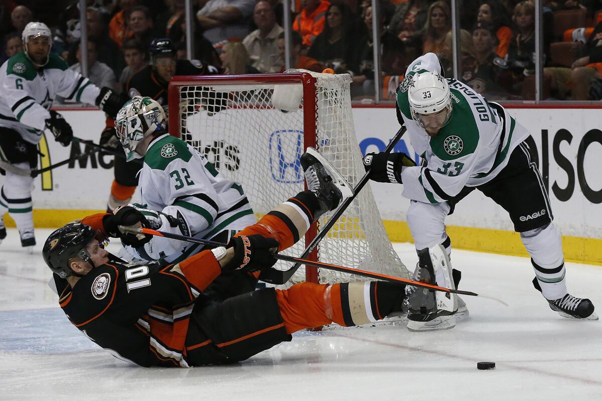 Ducks winger Corey Perry (10) is knocked to the ice by Dallas defenseman Alex Goligoski in Game 2 of a Stanley Cup playoff series at the Honda Center.