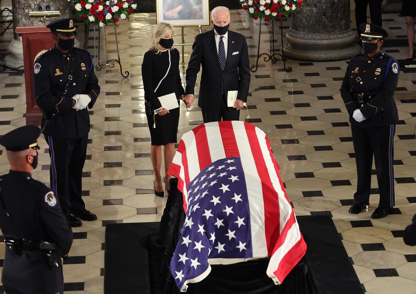 Joe Biden and his wife Jill Biden pay their respects to Justice Ruth Bader Ginsburg