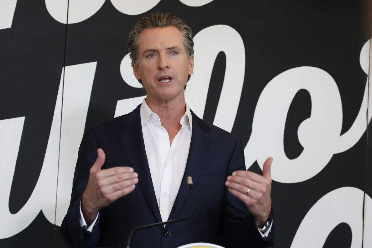 Gov. Gavin Newsom discusses his plan for the gradual reopening of California businesses during a news conference in Sacramento earlier this week.  