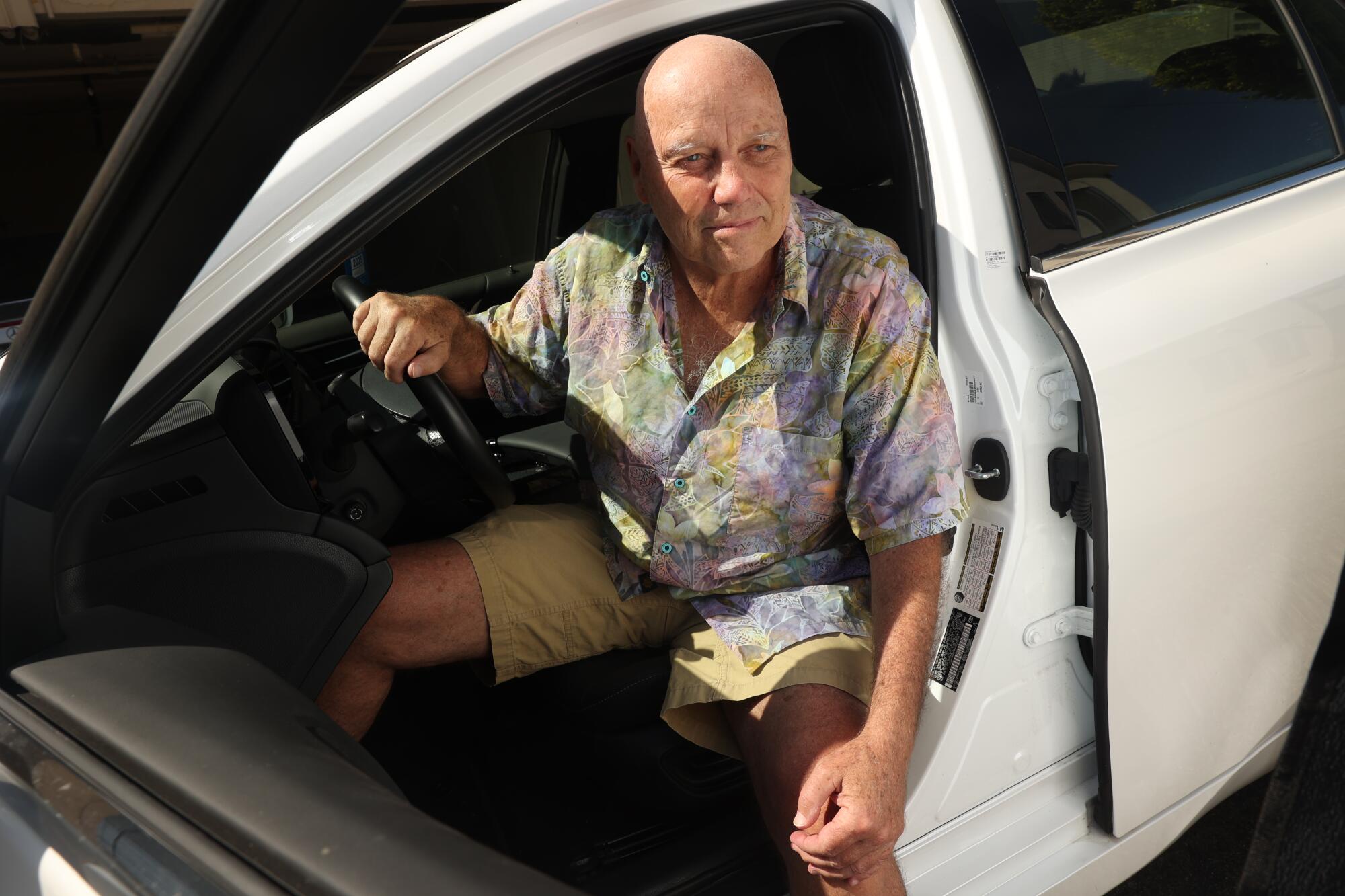  Bryan Caluwe poses for a portrait with his Toyota Mirai, a fuel cell car on Wednesday, Aug. 7, 