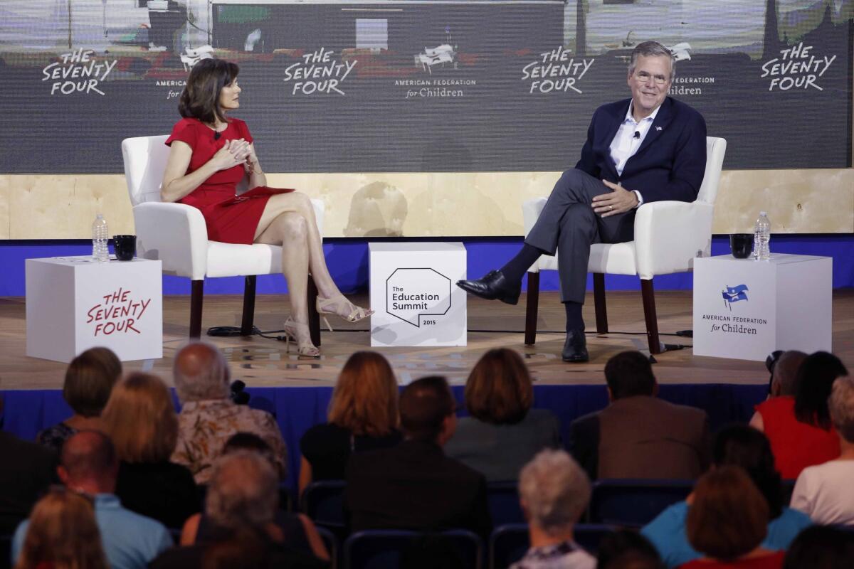 Former Florida Gov. Jeb Bush, right, who is vying for the GOP presidential nomination, speaks during an education summit in New Hampshire last month.